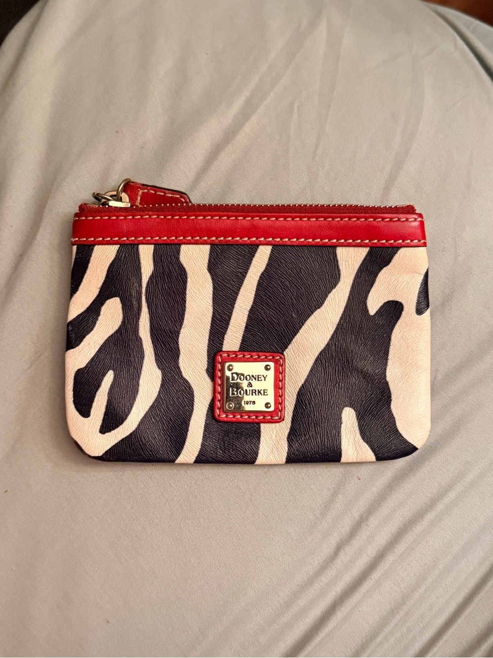 Dooney & Bourke Black and Cream Zebra Coin Pouch with Red Trim